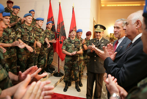 Albanian troops applaud President George W. Bush Sunday, June 10, 2007, after he greeted them at the Palace of Brigades in Tirana. The greeting came during the daylong visit that marked the first time a sitting U.S. president has been in the country. White House photo by Eric Draper
