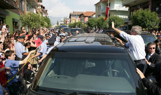 President George W. Bush waves to townspeople of Fushe Kruje, Albania, Sunday, June 10, 2007, as they turned out to welcome the first visit by a U.S. president to their country. White House photo by Eric Draper
