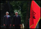 President George W. Bush stands next to President Alfred Moisiu of Albania, during arrival ceremonies Sunday, June 10, 2007, in Tirana, Albania. White House photo by Chris Greenberg