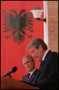 President George W. Bush listens to an interpretation of the remarks by Albania's Prime Minister Sali Berisha during a joint press availability Sunday, June 10, 2007, in Tirana, Albania. The visit marked the first to the country by a sitting president and came on the second to the last day of a seven-day, European tour. White House photo by Chris Greenberg