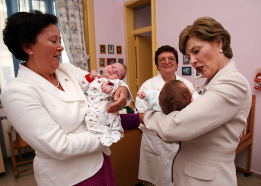 Mrs. Laura Bush holds a newborn at the Wellness Center at Queen Geraldine Hospital for Obstetrics and Gynecology in Tirana, Albania Sunday, June 10, 2007. White House photo by Shealah Craighead