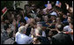 President George W. Bush reaches into a U.S. flag-waving crowd in Fushe Kruje, Albania Sunday, June 10, 2007, as hundreds of townspeople turned out to celebrate the first visit by a U.S. president to their country. White House photo by Shealah Craighead
