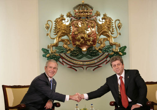 President George W. Bush and Bulgarian President Georgi Parvanov shake hands at their meeting in the Coat of Arms Hall in Sofia, Bulgaria, Monday, June 11, 2007. White House photo by Eric Draper
