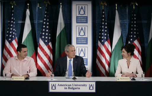 President George W. Bush gestures as he addresses a roundtable on free-market democracy at the American University in Sofia, Bulgaria, Monday, June 11, 2007, joined by Stanko Stankov, left, and Olga Borissova, the director of American University in Bulgaria Center. White House photo by Eric Draper