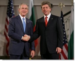 President George W. Bush and President Georgi Parvanov shake hands at the conclusion of their joint press availability Monday, June 11, 2007, in Sofia, Bulgaria.  White House photo by Chris Greenberg