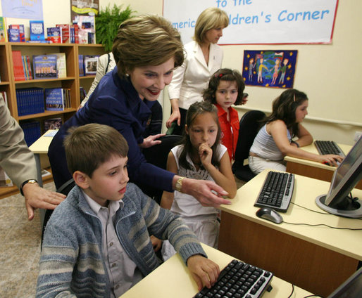Mrs. Laura Bush joins youngsters at the opening of the American Children's Corner at Sofia City Library Monday, June 11, 2007, in Sofia. Mrs. Bush said, "The books in this American Corner tell the story of the United States, describing my country's history, culture and diverse society. In these books, children in Sofia can discover literature that children in the United States enjoy." White House photo by Shealah Craighead