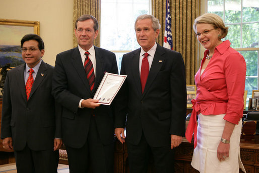 President George W. Bush receives the Report to the President on Issues Raised by the Virginia Tech Tragedy in the Oval Office Wednesday, June 13, 2007, presented to President Bush by Attorney General Alberto Gonzales; U.S. Secretary of Health and Human Services Michael O. Leavitt and U.S. Secretary of Education Margaret Spellings. The report was compiled by the departments of Justice, Health and Human Services and Education in response to the tragic shooting rampage at Virginia Tech April 16, 2007 in Blacksburg, Va. White House photo by Eric Draper