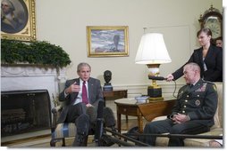 President George W. Bush meets with Lt. Gen. Martin E. Dempsey, former Commanding General of Multi-National Security and Transition Command - Iraq, in the Oval Office Thursday, June 14, 2007. The President thanked the general for his leadership saying, "It's an extraordinary country where people volunteer to go into combat zones, to protect the security of the United States of America. And we appreciate you, and thank you, and wish you all the best in your next assignment." White House photo by Joyce N. Boghosian