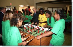 President George W. Bush joins a heated game of foosball Friday, June 15, 2007, during his visit to the Boys and Girls Club of South Central Kansas - 21st Street Club in Wichita. White House photo by Eric Draper