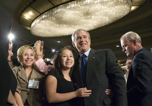 President George W. Bush greets audience members after addressing the National Hispanic Prayer Breakfast Friday, June 15, 2007, in Washington, D.C. “Our nation is more hopeful because of the Hispanic Americans who serve in the armies of compassion, who are surrounding neighbors in need who hurt with love; people who are helping to change America one heart and one soul and one conscience at a time,” said the President in his remarks. White House photo by Joyce N. Boghosian
