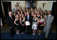 President George W. Bush stands with members of the University of Georgia Women's Gymnastics 2007 Championship Team Monday, June 18, 2007 at the White House, during a photo opportunity with the 2006 and 2007 NCAA Sports Champions. White House photo by Eric Draper