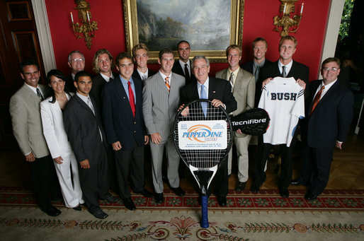 President George W. Bush stands with members of the Pepperdine University Men's Tennis 2006 Championship Team Monday, June 18, 2007 at the White House, during a photo opportunity with the 2006 and 2007 NCAA Sports Champions. White House photo by Eric Draper