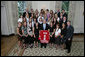 President George W. Bush stands with members of the University of Wisconsin-Madison Women's Ice Hockey 2006 Championship Team Monday, June 18, 2007 at the White House, during a photo opportunity with the 2006 and 2007 NCAA Sports Champions. White House photo by Eric Draper