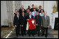 President George W. Bush stands with members of the University of Wisconsin-Madison Men's Indoor Track and Field 2007 Championship Team Monday, June 18, 2007 at the White House, during a photo opportunity with the 2006 and 2007 NCAA Sports Champions. White House photo by Eric Draper