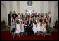President George W. Bush stands with members of the Northwestern University Women's Lacrosse 2006 Championship Team Monday, June 18, 2007 at the White House, during a photo opportunity with the 2006 and 2007 NCAA Sports Champions. White House photo by Eric Draper