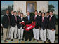 President George W. Bush stands with members of the Stanford University Men's Golf 2006 Championship Team Monday, June 18, 2007 at the White House, during a photo opportunity with the 2006 and 2007 NCAA Sports Champions. White House photo by Joyce N. Boghosian