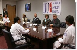 Mrs. Laura Bush participates in a roundtable at the Howard University Center for Infectious Disease Management and Research Tuesday, June 19, 2007, in Washington, D.C. Pictured with Mrs. Bush is, from left, Dr. Celia Maxwell, Director of the Women’s Health Initiative, D.C. Mayor Adrian Fenty and Dr. Tony Fauci, Director of the National Institute of Allergy and Infectious Diseases, National Institutes of Health. Dr. Maxwell invited experts to discuss HIV/AIDS and voluntary HIV testing. Howard University hospital, which is the first facility to implement throughout its entire institution voluntary HIV testing as part of routine medical care.  White House photo by Shealah Craighead