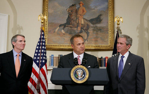 President George W. Bush and outgoing director of the Office of Management and Budget Rob Portman, left, listen as former Iowa Rep. Jim Nussle addresses the media Tuesday, June 19, 2007 in the Roosevelt Room of the White House, thanking President Bush for nominating him to be the next director of the OMB. White House photo by Chris Greenberg