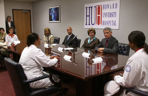 Mrs. Laura Bush participates in a roundtable at the Howard University Center for Infectious Disease Management and Research Tuesday, June 19, 2007, in Washington, D.C. Pictured with Mrs. Bush is, from left, Dr. Celia Maxwell, Director of the Women’s Health Initiative, D.C. Mayor Adrian Fenty and Dr. Tony Fauci, Director of the National Institute of Allergy and Infectious Diseases, National Institutes of Health. Dr. Maxwell invited experts to discuss HIV/AIDS and voluntary HIV testing. Howard University hospital, which is the first facility to implement throughout its entire institution voluntary HIV testing as part of routine medical care. White House photo by Shealah Craighead