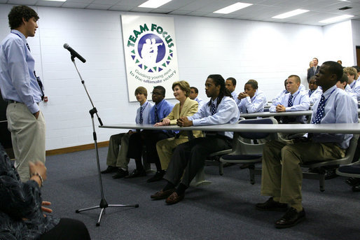 Mrs. Laura Bush listens to Team Focus class participants Thursday, June 21, 2007, in Mobile, Ala., share their personal stories in the “Yesterday, Today, Tomorrow” class during a visit to Team Focus’s National Leadership Camp, as part of Helping America’s Youth initiative. To fatherless young men, Team Focus offers mentoring services such as summer academic programs, leadership camps, year-round mentoring and scholarships and college counseling. White House photo by Shealah Craighead