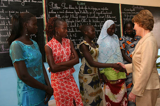 Mrs. Laura Bush meets Ambassador Girls' scholarship winners during a visit to Grand Medine Primary School Tuesday, June 26, 2007, in Dakar, Senegal. President Bush's Africa Education Initiative is working to provide 550,000 scholarships to girls throughout Africa by 2010. Pictured are, from left: Khady Diome, 15, of Diohine, Senegal; Fatou Djiby, 15, of Diakhao, Senegal; Christine Ndiaye, 14, of Diakhao, Senegal; Yamama Diop, 15, of Maroneme, Senegal; and Nango Dang, 16, of Thicky Serere, Senegal. White House photo by Shealah Craighead