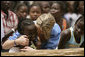 Ms. Jenna Bush hugs a little girl who danced during a performance Tuesday, June 26, 2007, by musician Youssou N'Dour for the children at Grand Medine Primary School in Dakar, Senegal. White House photo by Shealah Craighead