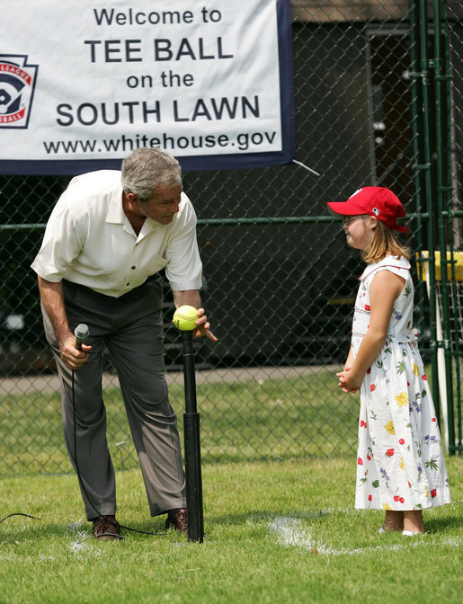 Under the watchful eye of Meredith Cripe, a member of the Chantilly, Virginia Little League Challenger League, President George W. Bush places a ball on the tee to start the game and the 2007 White House Tee Ball Season on the South Lawn. The game pitted the Bobcats from Cumberland, Maryland, against the Red Wings of Luray, Virginia. White House photo by Eric Draper