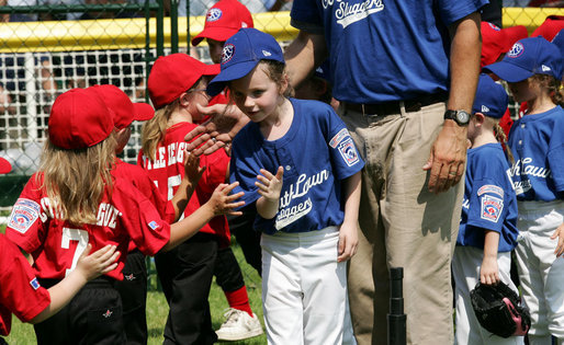 High-fives abound between the Luray, Virginia Red Wings and the Cumberland, Maryland Bobcats after the opening game of the 2007 White House Tee Ball season Wednesday, June 27, 2007, on the South Lawn. White House photo by Eric Draper