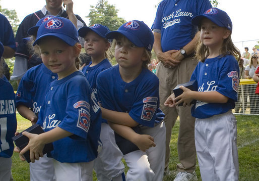 Members of the Cumberland, Maryland Bobcats look on during the presentation of game balls Wednesday, June 27, 2007, after their opening game of the 2007 White House Tee Ball season against the Luray, Virginia Red Wings on the South Lawn. White House photo by Chris Greenberg