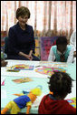 Mrs. Laura Bush visits with young patients at Maputo Central Pediatric Day Hospital Wednesday, June 27, 2007, in Maputo, Mozambique. Said Mrs. Bush, "It is terrific to be here at the Pediatric Day Hospital; I was thrilled the beautiful artwork that the children created to express their ideas and feelings, and I enjoyed meeting the mothers of those children in the Positive Tea support group. The Positive Tea support group is a great opportunity for mothers to come together to discuss their concerns and questions." White House photo by Shealah Craighead