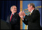 President George W. Bush is applauded by Rhode Island Governor Donald L. Carcieri prior to his address at the Naval War College in Newport, R.I., Thursday, June 28, 2007. White House photo by Eric Draper