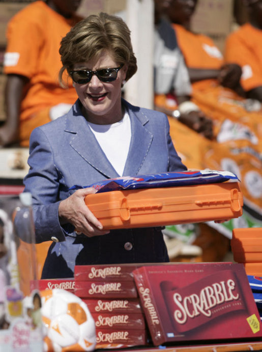 Mrs. Laura Bush assembles a home care kit at the Mututa Memorial Center Thursday, June 28, 2007, in Lusaka, Zambia. The center provides many humanitarian services including home-based care for people living with HIV/AIDS, care for orphans and promotes abstinence and faith for youth. It serves more than 150 individuals with a core of 36 trained caregivers. White House photo by Shealah Craighead