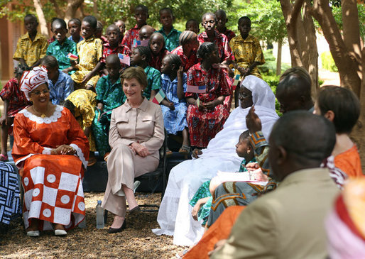 Mrs. Laura Bush and First Lady Toure Lobbo Traore of Mali, left, meet with students and teachers at the Nelson Mandela Primary School Complex Friday, June 29, 2007, in Bamako, Mali. The United States is partnering with African nations in the Africa Education Initiative, a $600 million dollar investment that will provide 550,000 scholarships to African children and train thousands of teachers by 2010. White House photo by Shealah Craighead