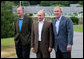 President George W. Bush stands with Russian President Vladimir Putin and Former President George H.W. Bush after Putin's arrival at Walker's Point in Kennebunkport, Maine, Sunday, July 1, 2007. White House photo by Eric Draper