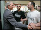 President George W. Bush is greeted by Samir Elnahass, center, and his cousin Freddie Slyman, on his arrival to Slyman’s Restaurant in Cleveland, Ohio, Tuesday, July 10, 2007, where President Bush attended a luncheon with community leaders. White House photo by Chris Greenberg