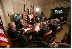 President George W. Bush meets with members of his National Security team Friday, July 13, 2007, in the Roosevelt Room at the White House during a video teleconference with Iraq Provincial Recontsruction Team Leaders, Embedded Provincial Reconstruction Team Leaders and Brigade Combat Commanders.  White House photo by Eric Draper