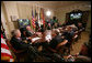 President George W. Bush meets with members of his National Security team Friday, July 13, 2007, in the Roosevelt Room at the White House during a video teleconference with Iraq Provincial Recontsruction Team Leaders, Embedded Provincial Reconstruction Team Leaders and Brigade Combat Commanders. White House photo by Eric Draper