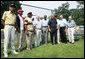 President George W. Bush, joined Baseball Hall of Fame player and honorary tee ball commissioner Frank Robinson, center, along with Hall of Fame manager Tommy Lasorda and fellow legendary players, retire the number of baseball great Jackie Robinson at the White House Tee Ball Game Sunday, July 15, 2007, on the South Lawn of the White House. All players wore the number 42 to celebrate the legacy of Jackie Robinson. More about Tee Ball on the South Lawn. White House photo by Chris Greenberg