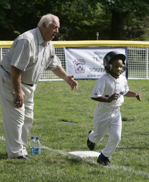 Hall of Fame baseball manager Tommy Lasorda urges on a player from the Wrigley Little League Dodgers of Los Angeles, as he runs for home against the Inner City Little League of Brooklyn, N.Y., Sunday, July 15, 2007, during the White House Tee Ball Game celebrating the legacy of Jackie Robinson on the South Lawn of the White House. Brooklyn and Los Angeles represent the two home cities of Robinson’s team. More about Tee Ball on the South Lawn. White House photo by Joyce N. Boghosian