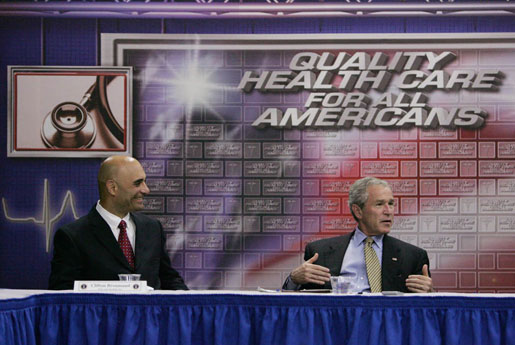 President George W. Bush talks with Clifton Broumand, CEO of Man & Machine, Inc. during in a roundtable discussion about health care initiatives after touring Mr. Broumand's company Wednesday, July 18, 2007, in Landover, Md. White House photo by Chris Greenberg