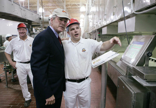 President George W. Bush is shown a section of the bun production line by an employee Thursday, July 19, 2007, at the Nashville Bun Company in Nashville, Tenn. White House photo by Chris Greenberg