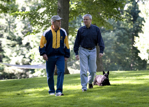 President George W. Bush and Chief of Staff Josh Bolten walk together with the President's dog, Barney, at Camp David, Saturday, July 21, 2007. White House photo by Eric Draper