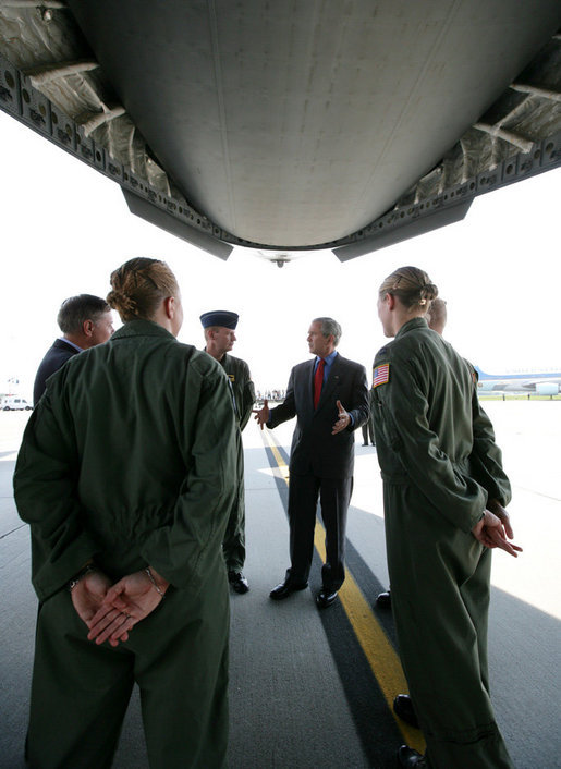 President George W. Bush meets with military personnel prior to boarding a C-17 aircraft to watch cargo loading operations Tuesday, July 24, 2007, during a visit to Charleston AFB in Charleston, S.C. White House photo by Eric Draper