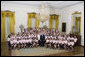 President George W. Bush poses with girl members of the 2007 Boys and Girls Nation delegates Wednesday, July 25, 2007, following his address to the group in the East Room of the White House. White House photo by Joyce N. Boghosian