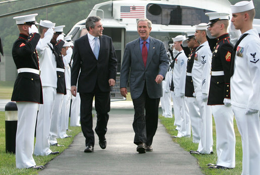 President George W. Bush and Prime Minister Gordon Brown of the United Kingdom, walk past an honor guard Sunday, July 29, 2007, after the Prime Minister's arrival at Camp David in Thurmont, Maryland. White House photo by Chris Greenberg