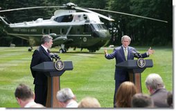 President George W. Bush and British Prime Minister Gordon Brown address the press Monday, July 30, 2007, at Camp David near Thurmont, Md. White House photo by Eric Draper