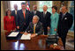 President George W. Bush signs into law H.R. 1, Implementing Recommendations of the 9/11 Commission Act of 2007, Friday, August 3, 2007, in the Oval Office. White House photo by Eric Draper