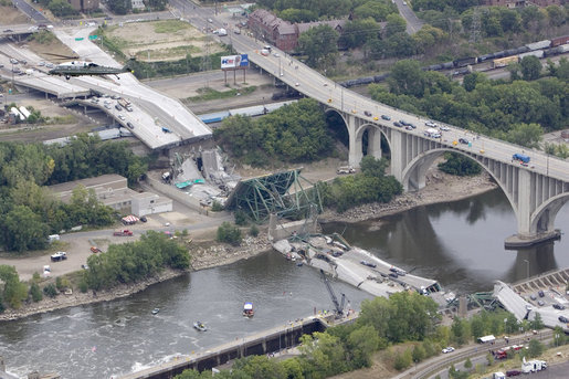 President George W. Bush, aboard Marine One, takes an aerial survey of the Interstate 35W bridge collapse in Minneapolis, Saturday, Aug. 4, 2007. President Bush said he would work to help local, state and federal authorities to cut through the red tape to get the bridge rebuilt as soon as possible. White House photo by Chris Greenberg