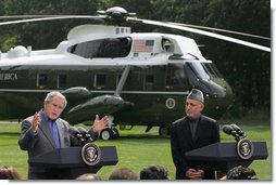 President George W. Bush, addresses the media during a joint press availability with Afghanistan President Hamid Karzai Monday Aug. 6, 2007, at Camp David near Thurmont, Md., saying, “ We’re working closely together to help the people of Afghanistan prosper. We work together to give the people of Afghanistan a chance to raise their children in a hopeful world. And we’re working together to defeat those who would try to stop the advance of a free Afghan society.” White House photo by Chris Greenberg