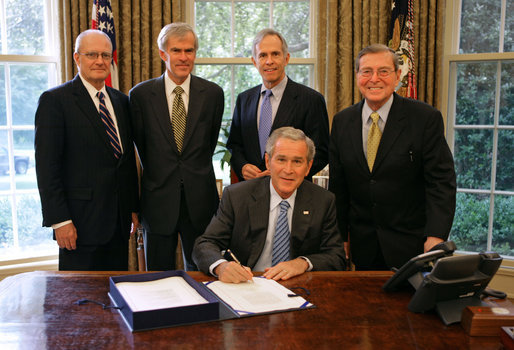 President George W. Bush signs H.R. 2272, The America Competes Act, Thursday, Aug. 9, 2007, in the Oval Office. Pictured with the President are, from left: Director John Marburger of the Office of Science and Technology Policy; Senator Jeff Bingaman of N.M.; Congressman Bart Gordon of Tenn.; and Senator Pete Domenici of N.M. White House photo by Chris Greenberg